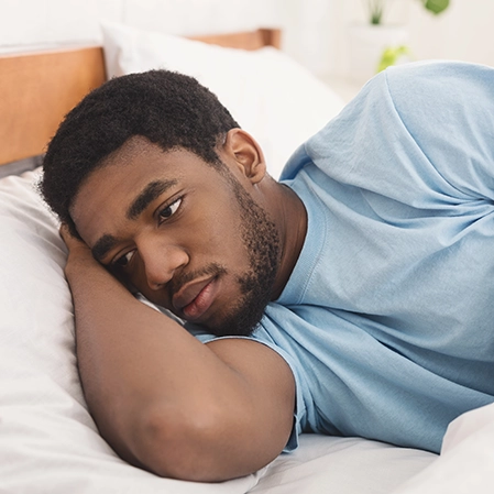 A man laying in bed.